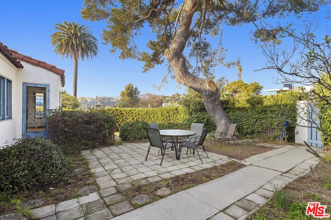 266 Mabery Road Santa Monica, CA 90402 - Photo 19 of 29 a view of a backyard with table and chairs and potted plants