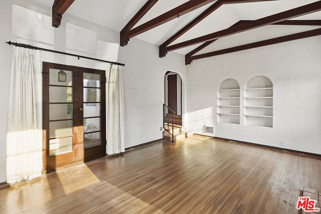 266 Mabery Road Santa Monica, CA 90402 - Photo 7 of 29 an empty room with wooden floor and windows