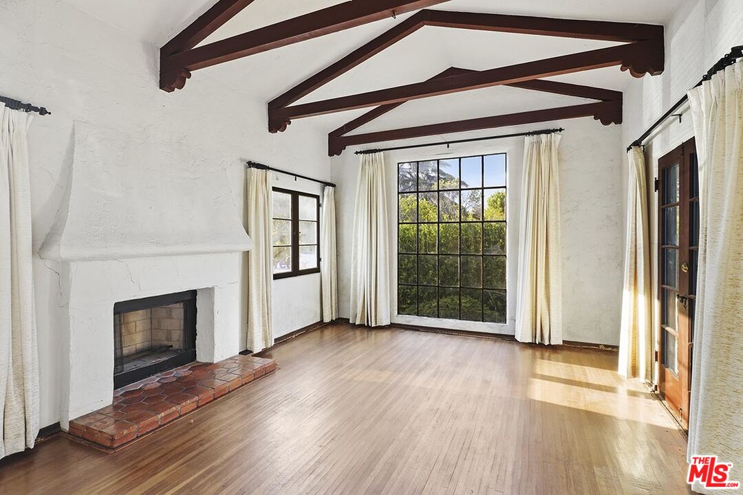 266 Mabery Road Santa Monica, CA 90402 - Photo 8 of 29 a view of an empty room with wooden floor and a window