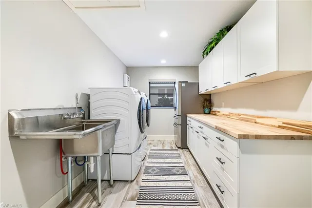 a view of a livingroom with furniture and floor to ceiling window