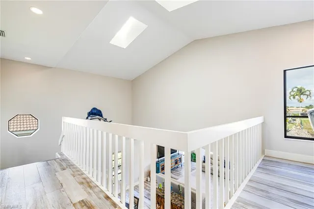 an aerial view of a houses with a city view