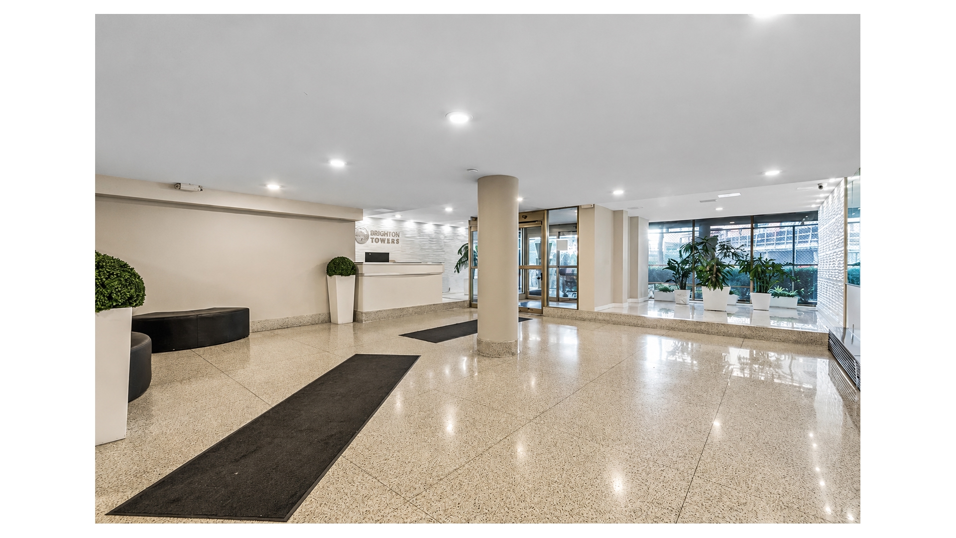 40 Brighton 1st Road, Unit 1A Brooklyn, NY 11235 - Photo 6 of 12 a view of a living room and floor to ceiling window