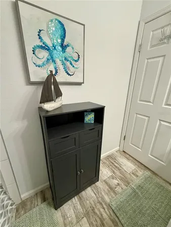 a white toilet sitting next to a bathroom sink