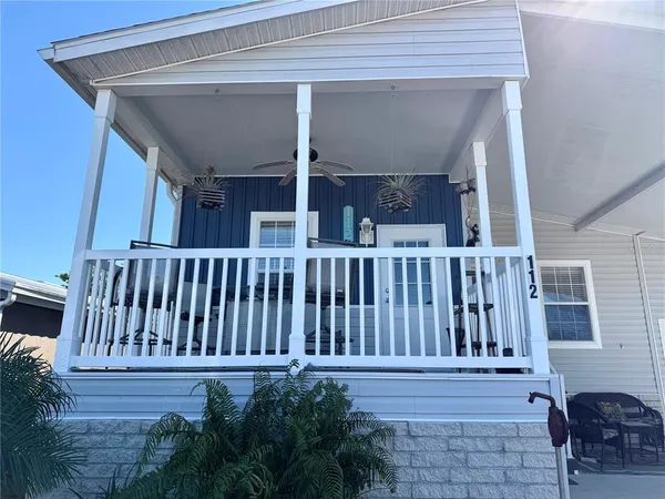 a view of a house with porch and wooden floor