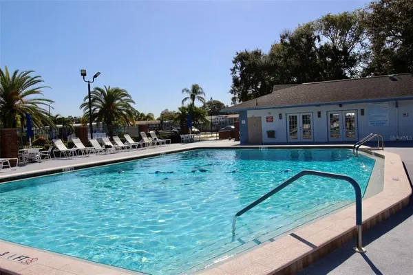 a view of a swimming pool with a patio