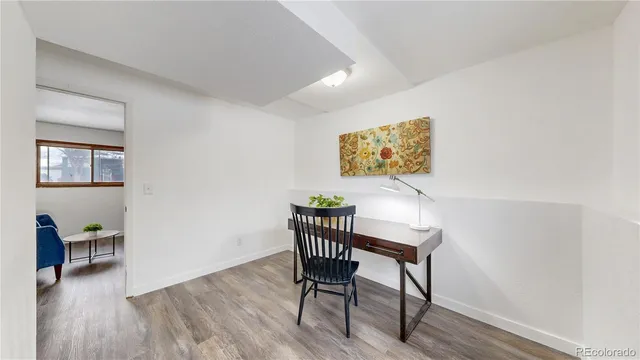 a workspace with furniture and wooden floor