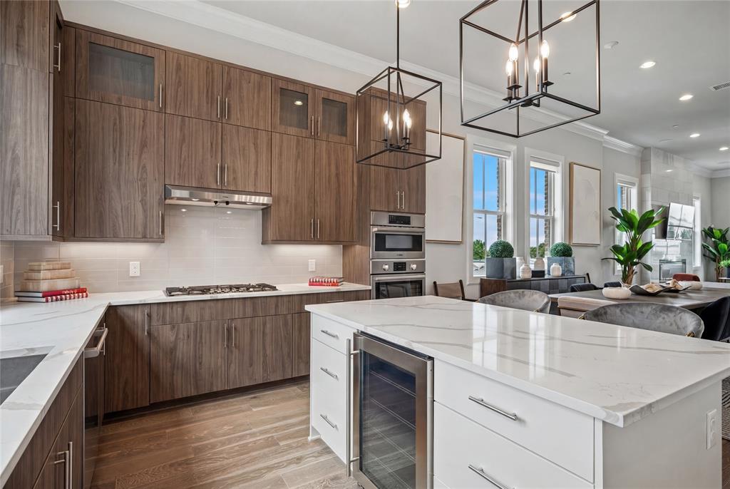 a kitchen with stainless steel appliances a sink and stove