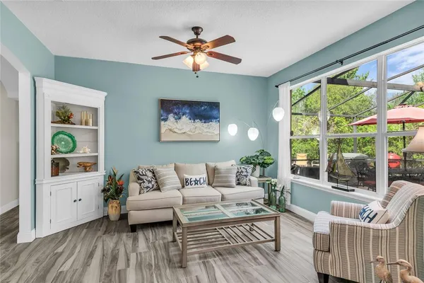 a bathroom with a granite countertop sink mirror vanity and toilet