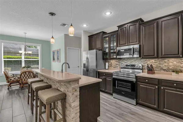 a view of walk in closet with clothes