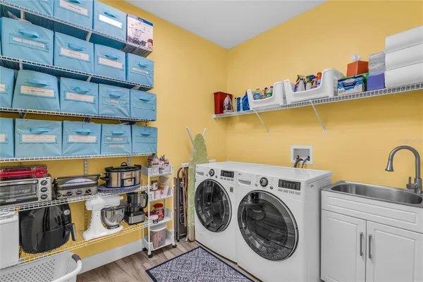 a spacious bathroom with a granite countertop sink a mirror and a