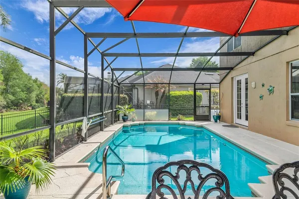 a bedroom with a bed and ceiling fan