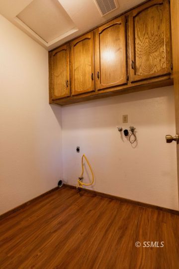 321 South Locust Street Ridgecrest, CA 93555 - Photo 27 of 30 a view of a room with wooden floor