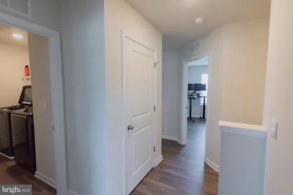a white toilet sitting next to a white sink