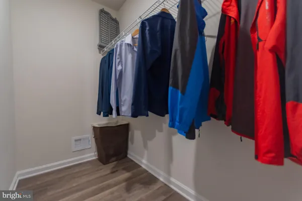 a view of an empty walk in closet with empty racks
