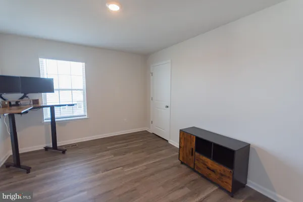 a view of staircase with wooden floor