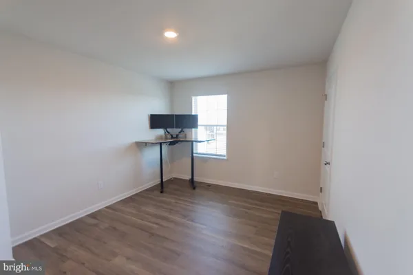 a view of a hallway with washer and dryer