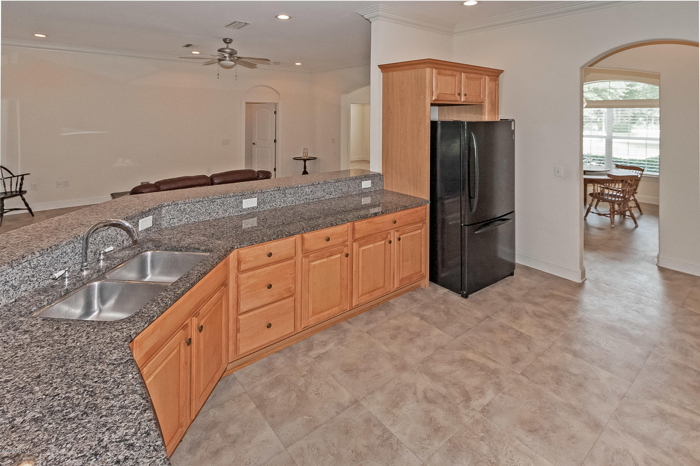 3377 Kings Road South St. Augustine, FL 32086 - Photo 9 of 33 a large kitchen with cabinets and stainless steel appliances