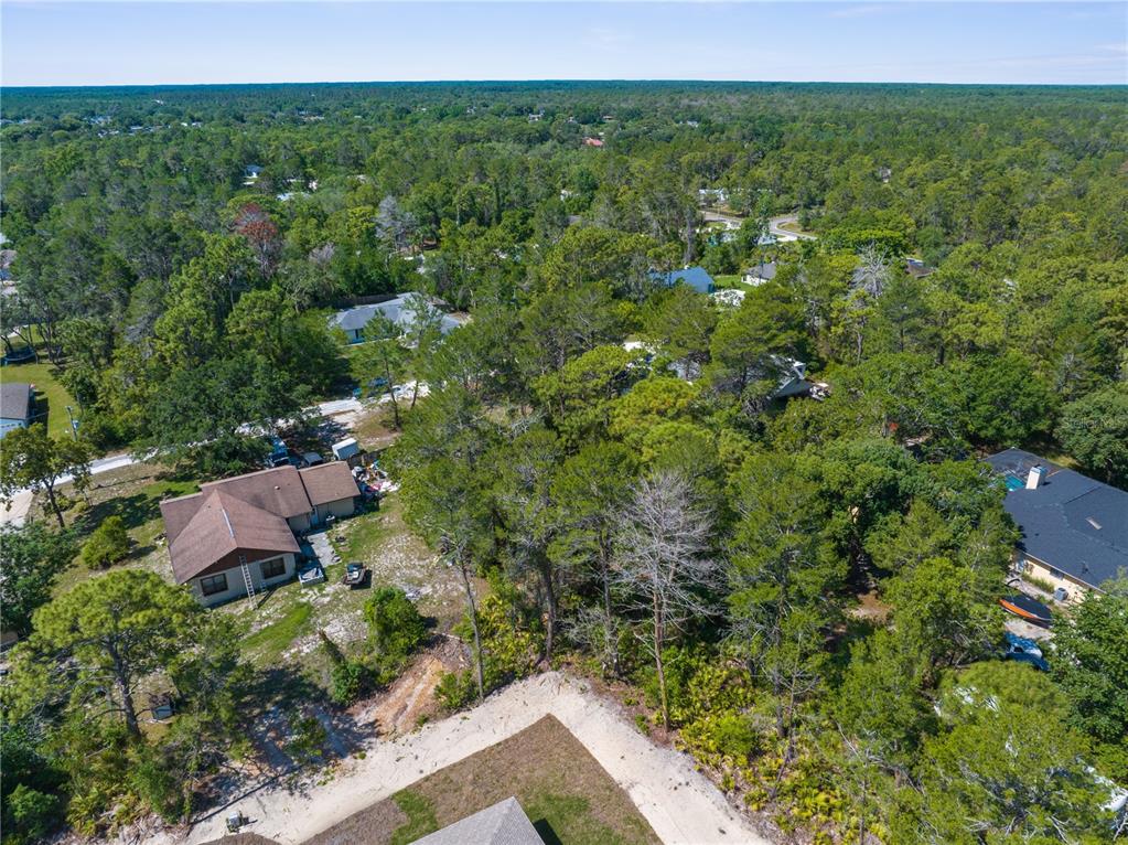 0 Carrie Way Weeki Wachee, FL 34613 - Photo 5 of 9 a view of a house with a yard