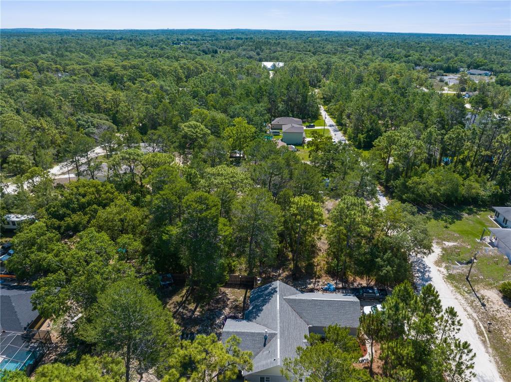 0 Carrie Way Weeki Wachee, FL 34613 - Photo 8 of 9 an aerial view of a house with a yard