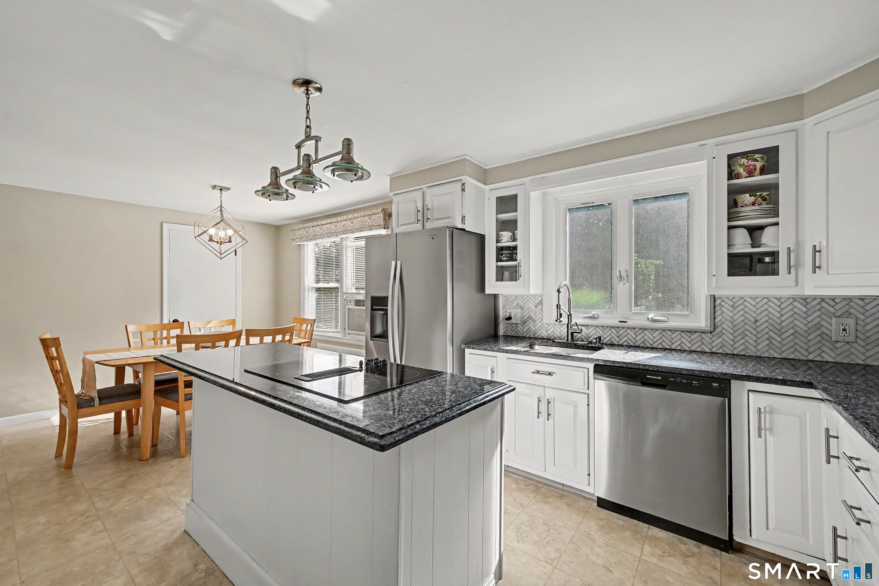 524 Ferry Road Orange, CT 06477 - Photo 13 of 40 a kitchen with stainless steel appliances granite countertop a sink stove and refrigerator