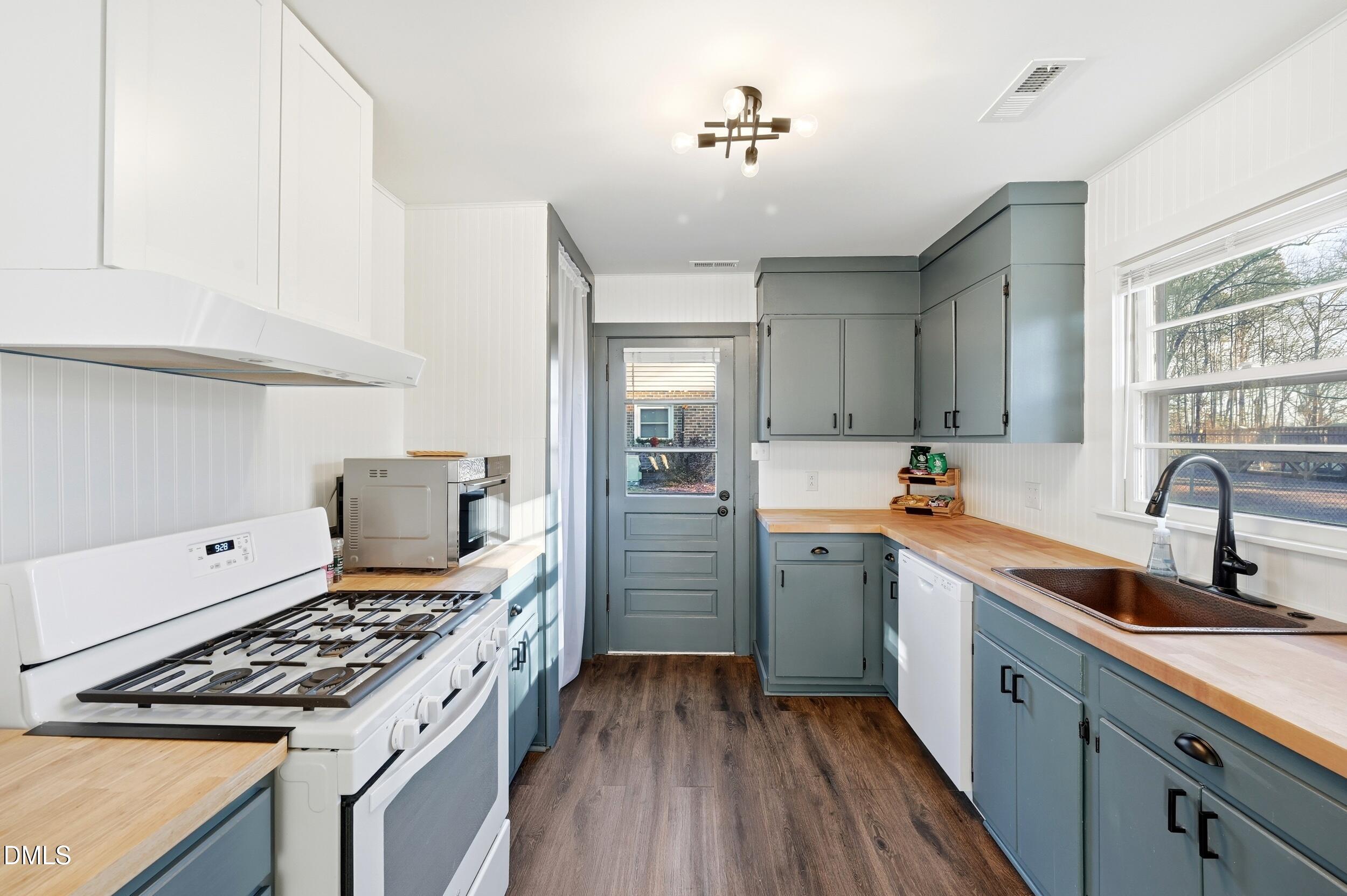 608 Hillhaven Terrace Roxboro, NC 27573 - Photo 11 of 31 a kitchen with a sink stove and refrigerator