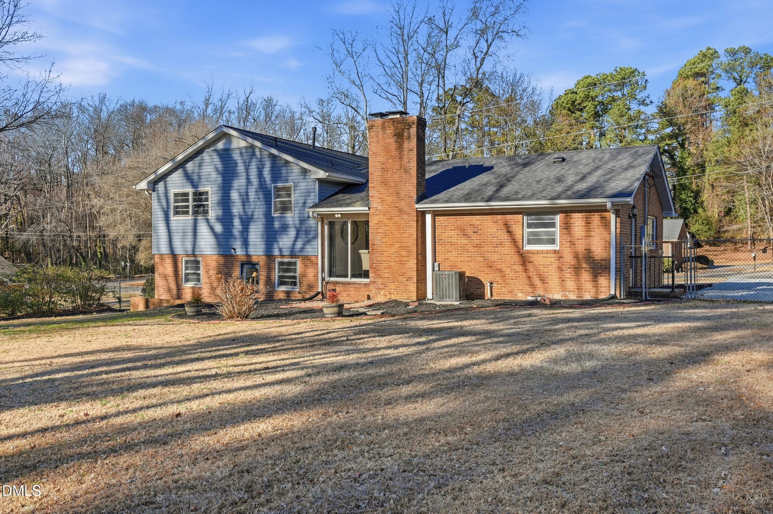 608 Hillhaven Terrace Roxboro, NC 27573 - Photo 22 of 31 a view of a house with a yard and large trees