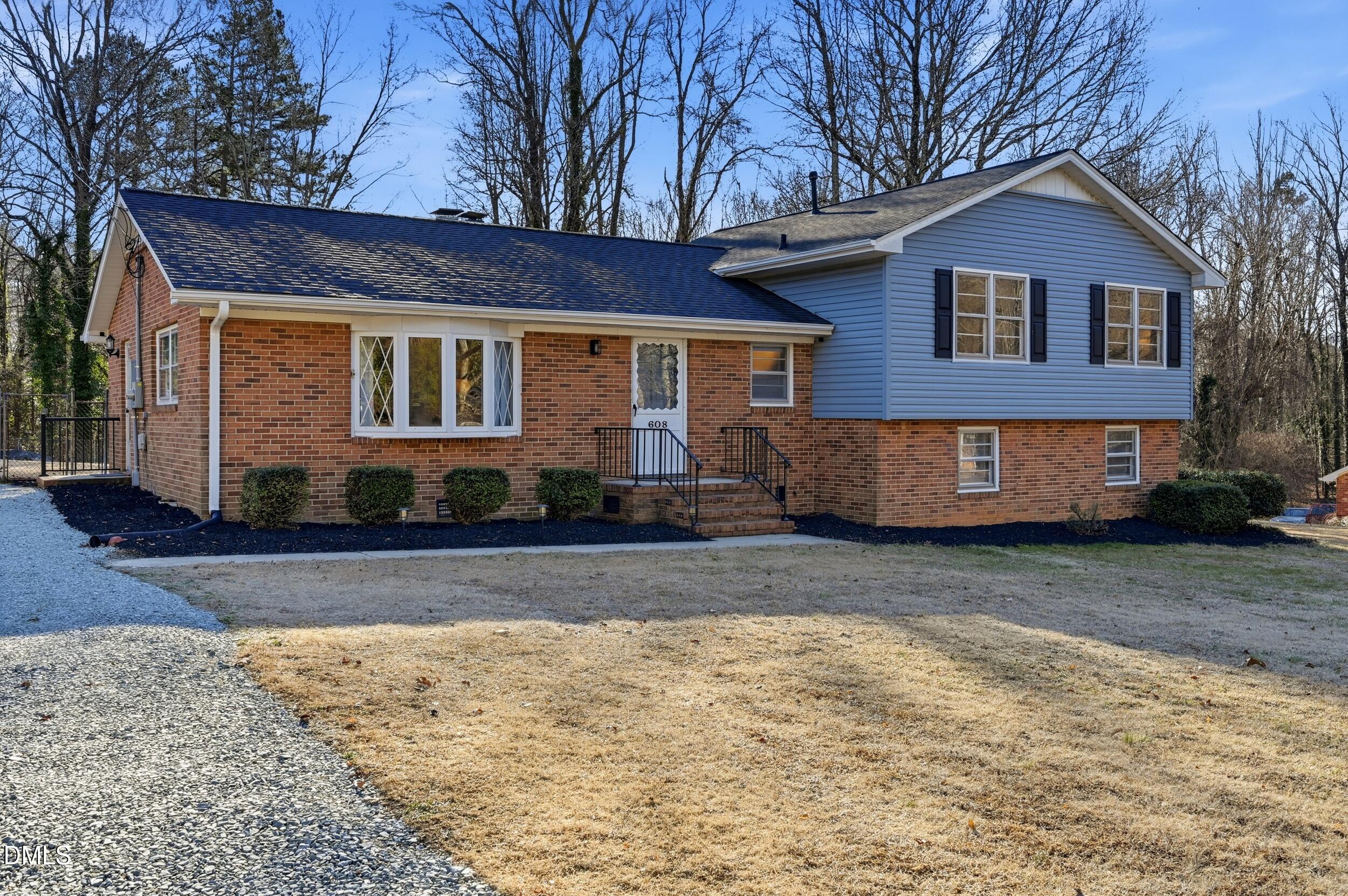 608 Hillhaven Terrace Roxboro, NC 27573 - Photo 2 of 31 a front view of a house with a yard