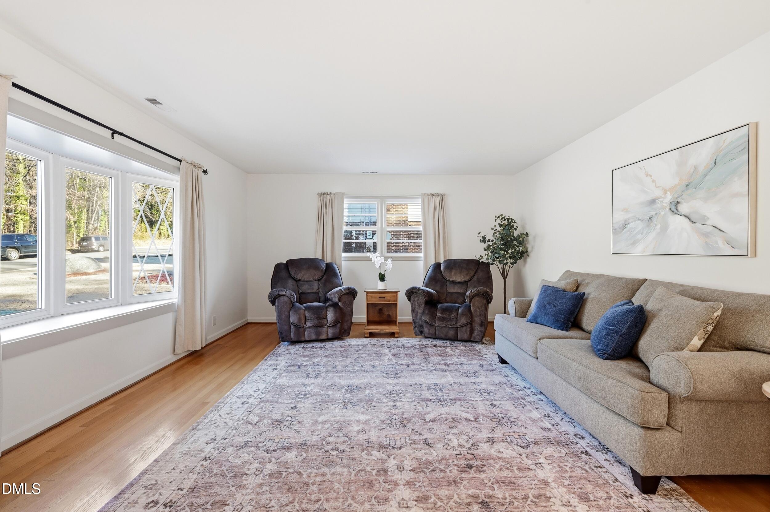 608 Hillhaven Terrace Roxboro, NC 27573 - Photo 6 of 31 a living room with furniture large window and lamp