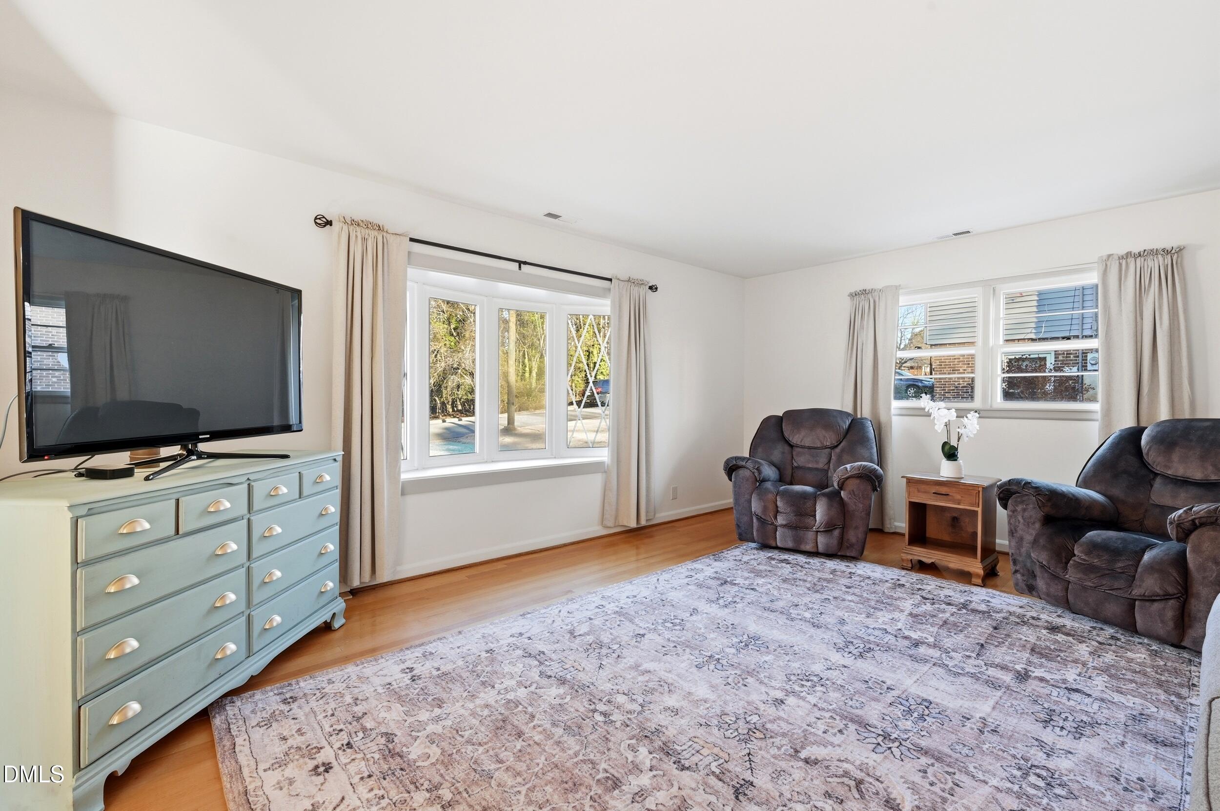 608 Hillhaven Terrace Roxboro, NC 27573 - Photo 7 of 31 a living room with furniture and a flat screen tv