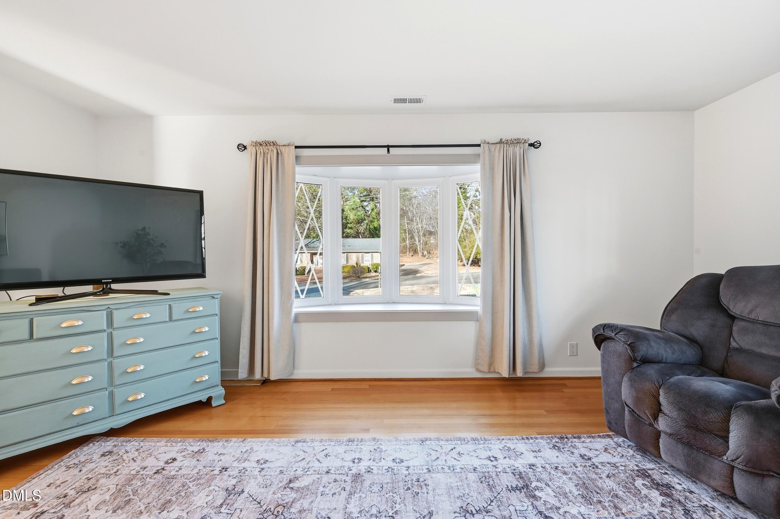 608 Hillhaven Terrace Roxboro, NC 27573 - Photo 8 of 31 a living room with furniture and a flat screen tv