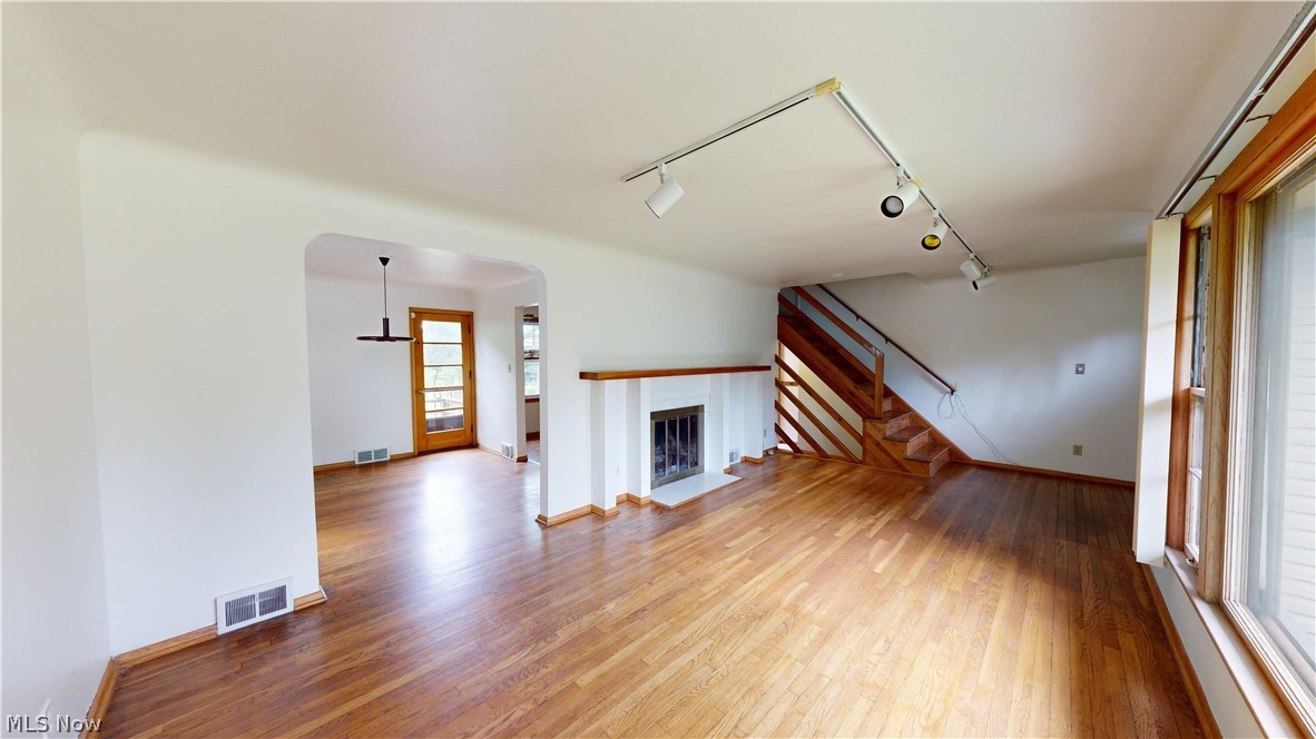 1508 Edgefield Road Lyndhurst, OH 44124 - Photo 2 of 28 Unfurnished living room with track lighting and hardwood / wood-style floors