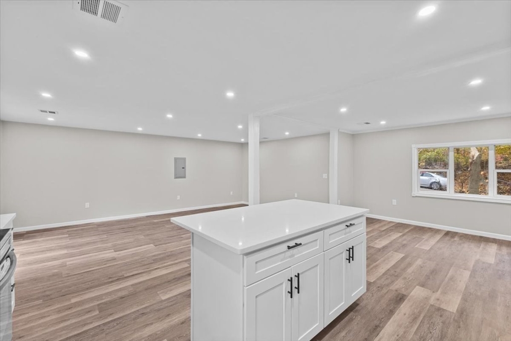 54 Mildred Road Brockton, MA 02302 - Photo 13 of 30 a view of a kitchen counter space and wooden floor