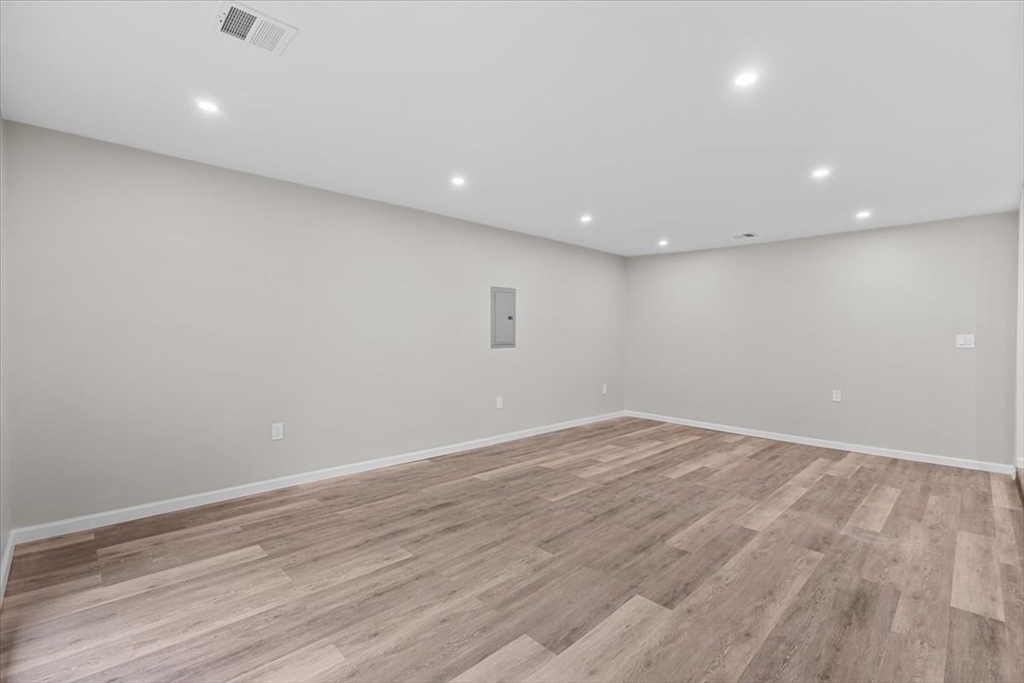 54 Mildred Road Brockton, MA 02302 - Photo 14 of 30 an empty room with wooden floor and windows