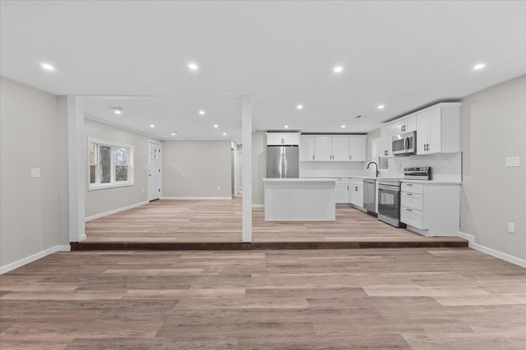 54 Mildred Road Brockton, MA 02302 - Photo 18 of 30 a view of kitchen with kitchen island wooden cabinets and center island