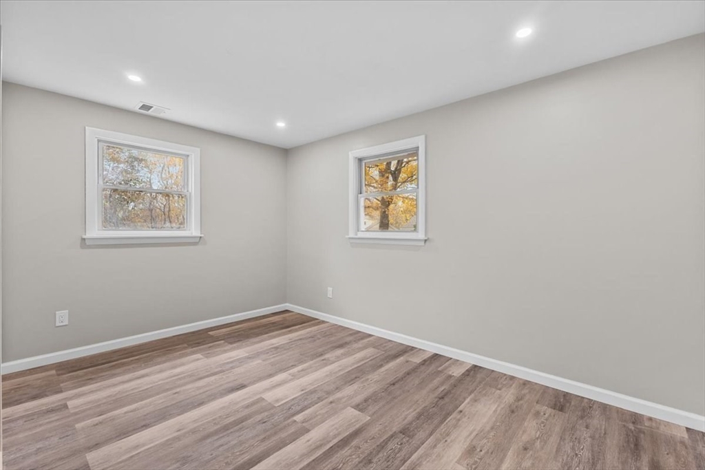 54 Mildred Road Brockton, MA 02302 - Photo 23 of 30 a room with a wooden floor and a window