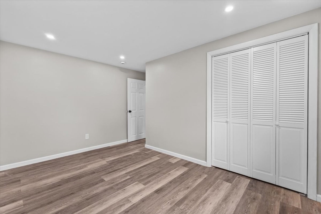 54 Mildred Road Brockton, MA 02302 - Photo 24 of 30 a view of an empty room with wooden floor