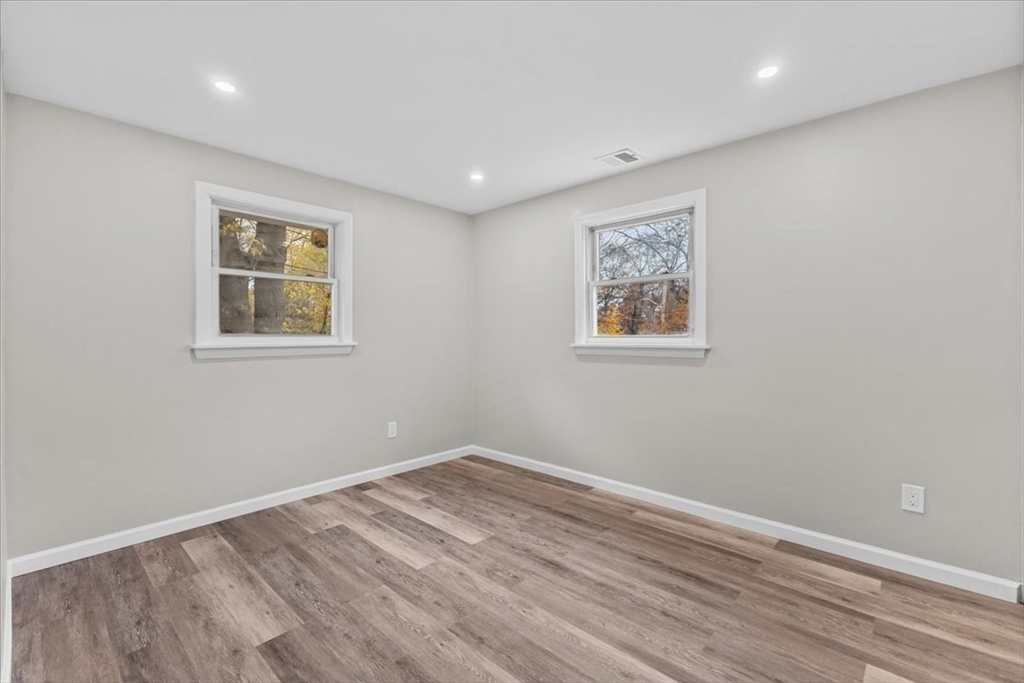 54 Mildred Road Brockton, MA 02302 - Photo 25 of 30 a view of room with window and wooden floor