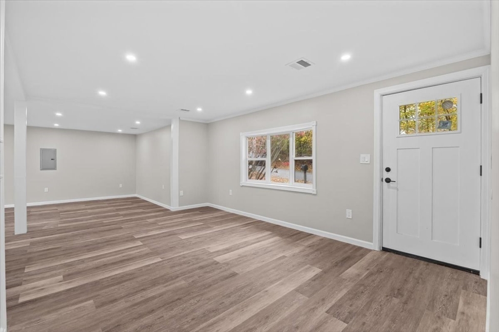 54 Mildred Road Brockton, MA 02302 - Photo 9 of 30 a view of empty room with wooden floor and fan