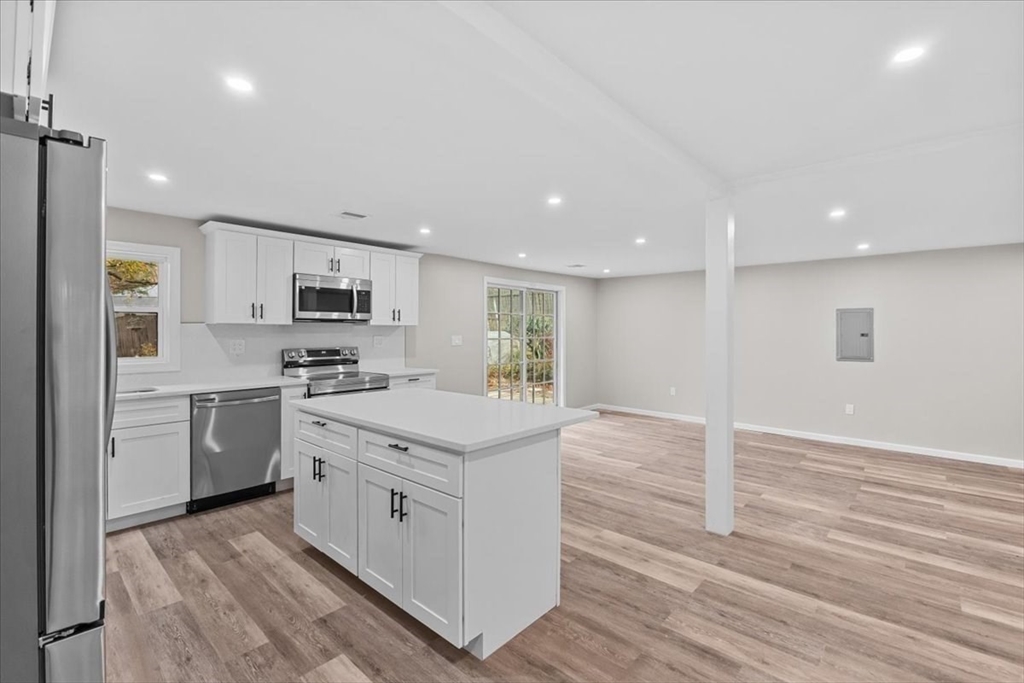 54 Mildred Road Brockton, MA 02302 - Photo 10 of 30 a kitchen with white cabinets stainless steel appliances and sink