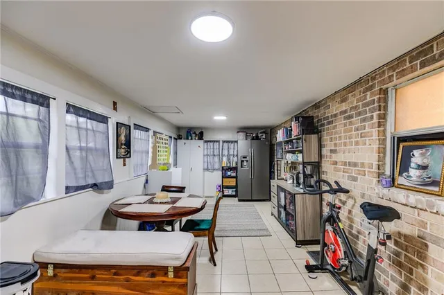 a living room with fireplace furniture and a book shelf