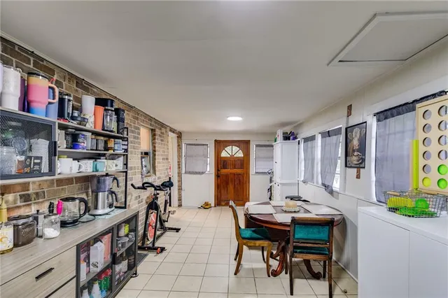 a living room with lots of furniture and a book shelf
