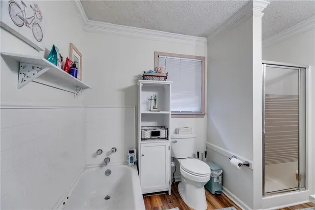 a white toilet sitting next to a bathroom sink