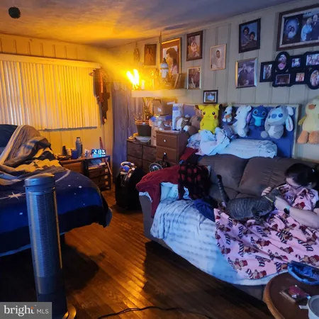a view of storage and utility room with a refrigerator