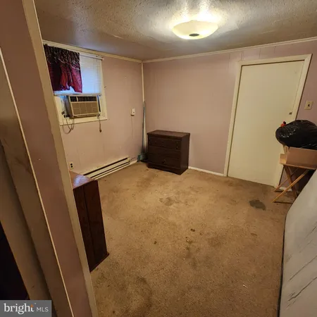 a bathroom with a sink a toilet and shower curtain