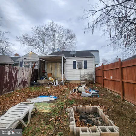 a backyard of a house with yard and outdoor seating