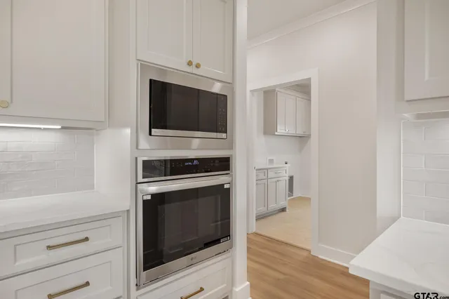 a kitchen with a stove and a microwave