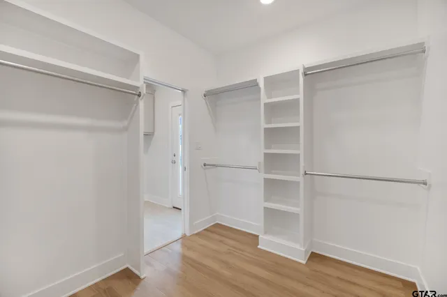 a view of an empty walk in closet