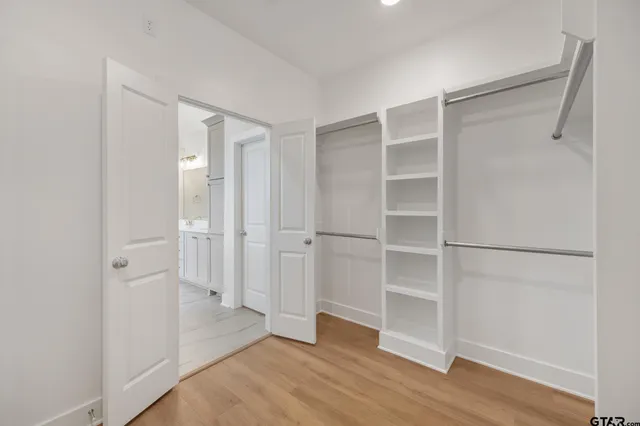 a view of an empty walk in closet