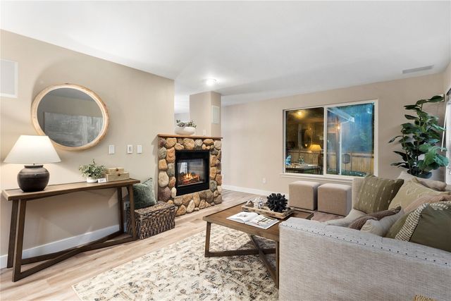 a kitchen with stainless steel appliances a refrigerator sink and cabinets