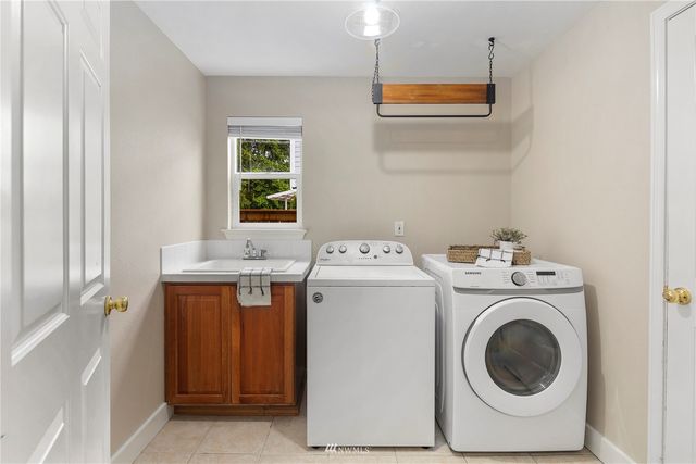 a bedroom with a bed and a lamp